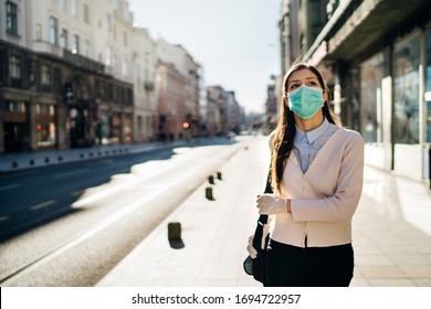 Concerned Woman Walking To Work In Public Space During Pandemic.Effect Of The COVID-19.Protective Measure,mask Wearing.Respecting Guidelines.Empty Streets.Fear Of Coronavirus.Quarantine Mental Stress