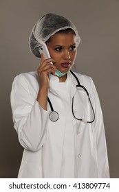 Concerned Young Doctor Talking On The Phone