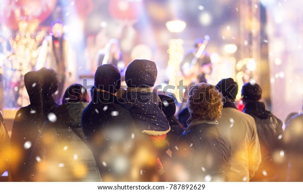 Concert crowd.\
Winter family event\
background