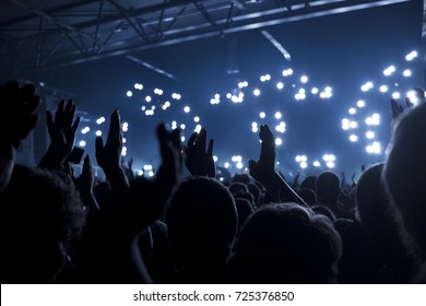 Concert Goers Applauding Inside A Music Venue - Selective Focus