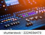 Concert sound mixer panel with volume regulators. Professional audio and light equipment for sound recording studio, live music broadcasting, television, party. mixing console. audio signals.