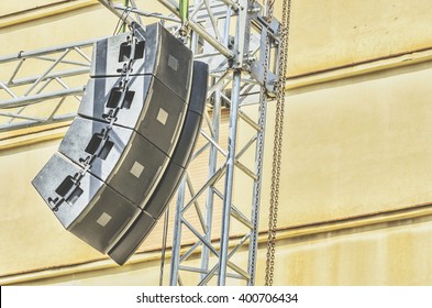 Concert Sound System On Metal Structures At Height Outdoor With Old Building In Background.Selective Focus.