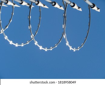 Concertina Wire. Blue Sky Background