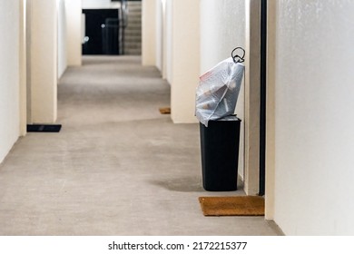 Concierge Valet Door To Door Trash Collection Services For Apartment With Garbage In Bin And Plastic Bags For Pick Up In Residential Building Hallway Corridor Hall