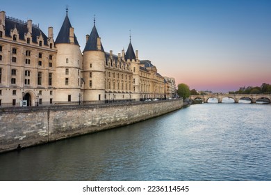 The Conciergerie palace and prison by the Seine river at dawn, Paris. France - Shutterstock ID 2236114545
