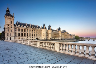The Conciergerie palace and prison by the Seine river at dawn, Paris. France - Shutterstock ID 2236114549