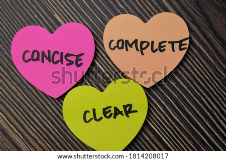Concise Complete Clear write on sticky notes isolated on office desk.