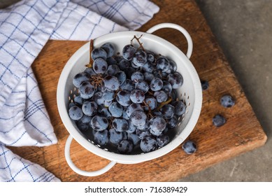 Concord Grapes in a Colander