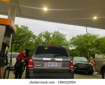 CONCORD, NC, UNITED STATES - May 13, 2021: A Woman Is Pumping Gas At Circle K Gas Station During The Gas Shortage Of 2021 