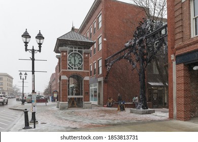 CONCORD, NH, USA - FEBRUARY 18, 2020: Clock on Main street. Street view of city in New Hampshire NH, USA.