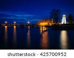 Concord Point Lighthouse and a pier at night in Havre de Grace, Maryland.