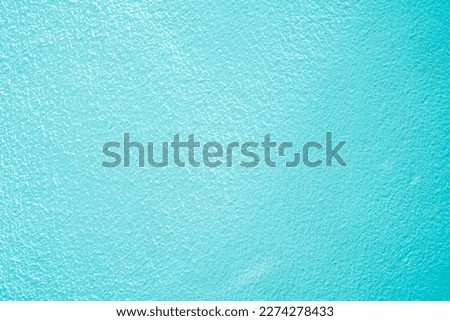 Concrete abstract wall of light cyan color, cement texture background for design.