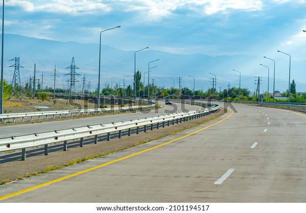 Concrete auto road. Concrete\
roads are very durable and more environmentally friendly compared\
to asphalt roads. 11 08 2021 Almaty region Central Asia\
Kazakhstan