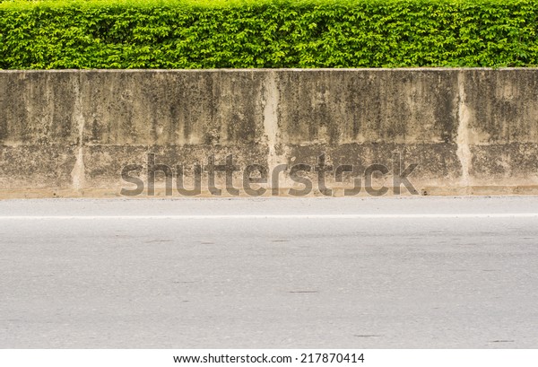 Concrete between Barrier\
Road