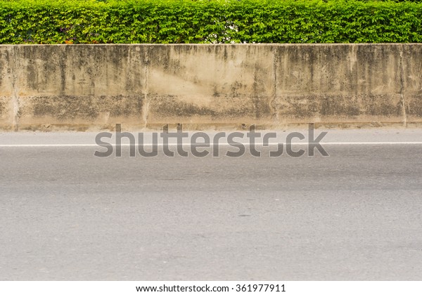 Concrete between Barrier\
Road