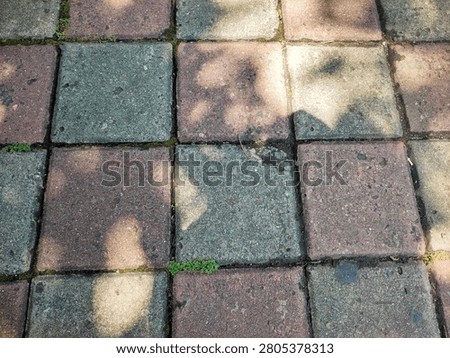 concrete block footpath on the side of the road