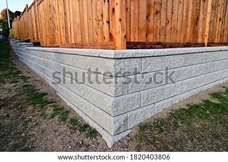 concrete block wall closeup corner retaining wall fence panels  