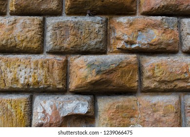 Concrete block wall, stone texture. The historic wall. A fragment of a wall of the Palazzo Pitti.