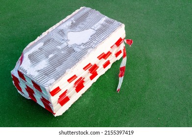 concrete block wrapped with restrictive tape - Shutterstock ID 2155397419