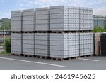 Concrete Cinder Blocks in Industrial Pallets, Grey brick Shapes building material. New for use on construction site or store in europe