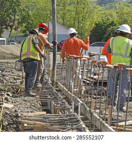 Concrete Construction Contractor Using A Concrete Pump To Fill The Foundation For A New Commercial Building