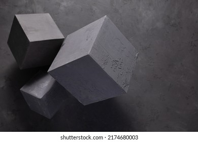 Concrete cube shape at floor background texture. Cement block as construction concept