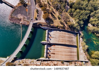 Concrete Dam And Spill Way Next To A Road And Bridge On Coxs River In Blue Mountains Of Australia. Hydro Energy Dam Forms Lake Lyell In Scenic Area Of NSW Seen Top Down From Above.