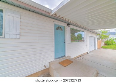 Concrete Doorstep Of A House With Light Blue Front Door