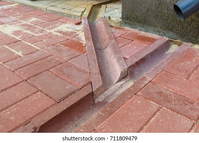 Concrete Drainage Gutters On The Sidewalk