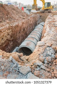 Concrete Drainage Pipe on a Construction Site .Concrete pipe stacked sewage water system aligned on site.Roll concrete at work site.