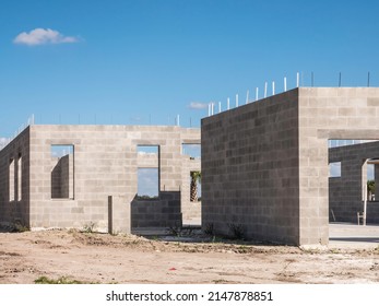 Concrete exterior of single-family house under construction in a suburban development on a sunny afternoon in southwest Florida - Shutterstock ID 2147878851