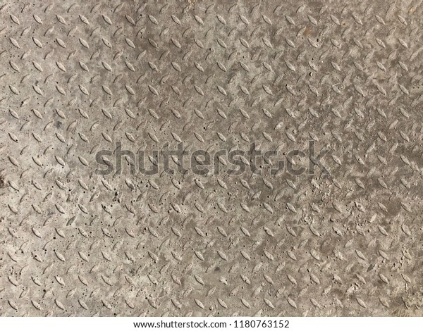 concrete floor with a texture. concrete texture\
background of old cement floor. Aged beton surface with sinks and\
craters like a moon surface. Gray wall or floor as background\
texture