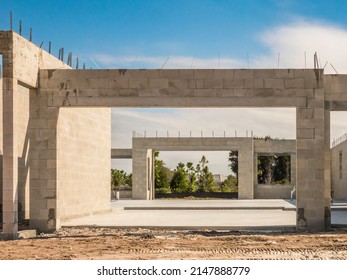 Concrete Foundation And Exterior Walls Of A Single-family House Under Construction In A Suburban Development On A Sunny Afternoon In Southwest Florida