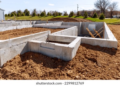 concrete foundation with reinforcement and metal slab construction site, process of house building cement ground block