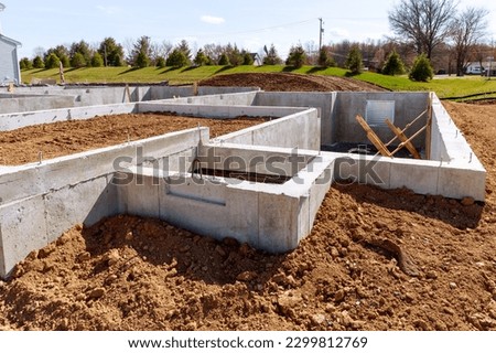 concrete foundation with reinforcement and metal slab construction site, process of house building cement ground block