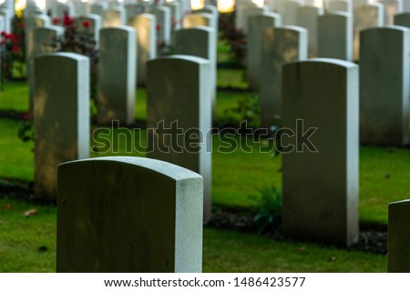 concrete graves on cementery rest in peace