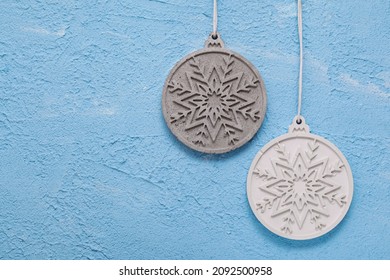 Concrete, Gypsum Christmas Ball On Blue Textured Gypsum. Joinery Tradition. New Year's Background For Building Store. Building Material Used In Construction. Cement, Gypsum Plaster.