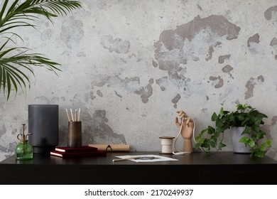 Concrete Interior Of Home Office With Copy Space. Black Desk, Image, Lamp And Office Accessories. Grey Concrete Wall. Home Decor. Template. 