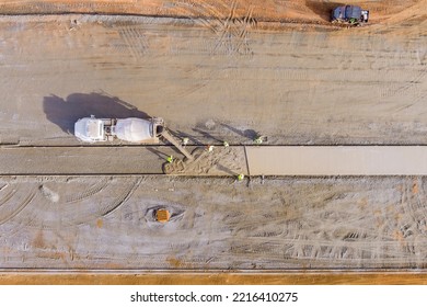 Concrete Mix Truck The Pouring Cement During To Residential Sidewalk Workers At Construction Site