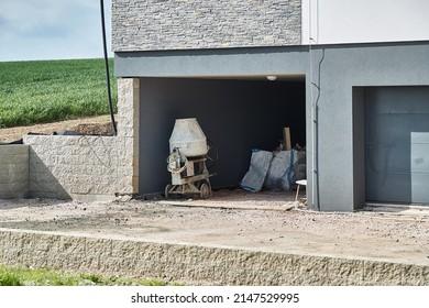 Concrete Mixer Construction Equipment In A Garage For Building New Driveway