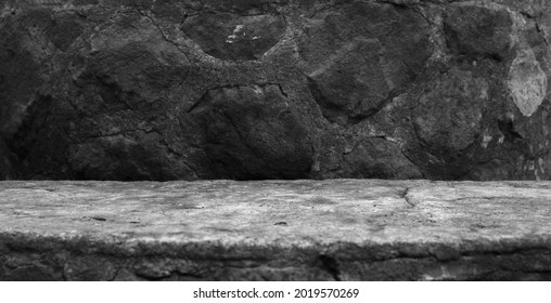 A Concrete Moulding, Showing a Very Old Semi Circle Base with Imprints and Grit to the Surface, For a Product Display with a Natural Stone Blurred Foreground and Background.