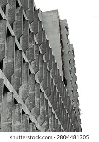 Concrete panels forming a geometric pattern on a brutalist building facade