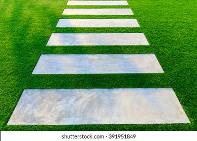 Concrete pathway and artificial grass