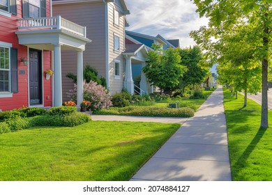 Concrete pavement of a sidewalk in front of the residential houses in Daybreak, Utah