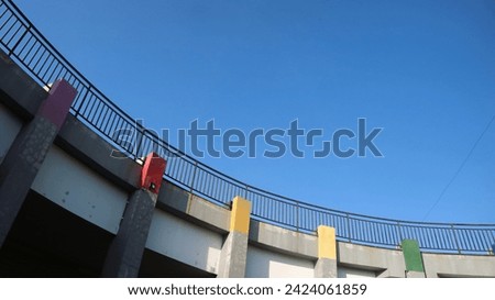 concrete pillar and fence with clear sky background, copy space