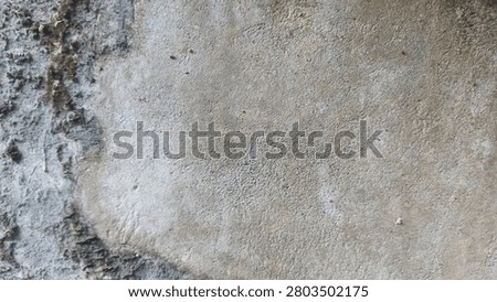 Concrete plaster texture with worn weathered surface, suitable for grunge backgrounds, urban decay themes, industrial design, and abstract overlays