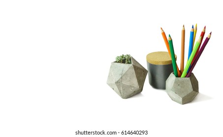 Concrete polygonal boxes with succulent plant and colorful drawing pencils isolated on white. - Powered by Shutterstock