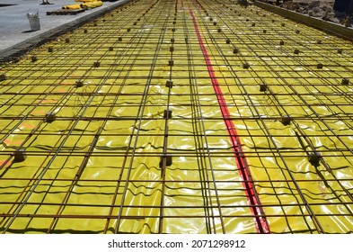 Concrete Pour With Reinforcing And Yellow Vapor Barrier