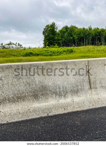 Concrete precast highway traffic barrier on\
highway 400 in central Ontario. Median dividers separating north\
and south bound\
traffic.