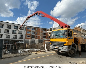 Concrete pump vehicle at the construction site - Powered by Shutterstock